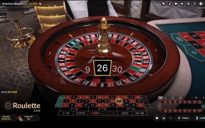 Live dealer roulette wheel with ball spinning under studio lights